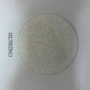 Close-up detail of holographic glitter badge backing card, special art paper material.