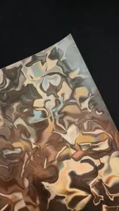 Close-up of fluid water ripple special paper sheet, metallic holographic badge backing texture