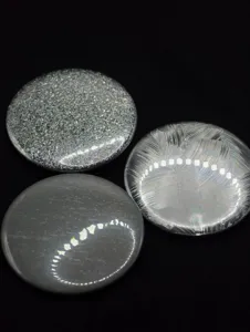 Holographic glitter backing paper for button badges and cards, featuring fine textures.