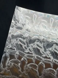 Detailed shot of silver holographic double flash badge backing paper texture 128g