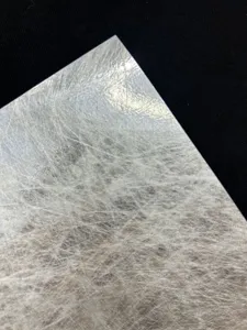 Detailed shot of glossy silk specialty paper backing, ideal for craft packaging.
