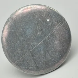 Close-up detail shot of holographic silk texture glitter badge protective film surface