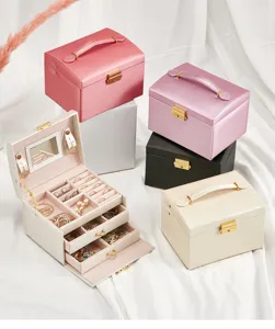 Multi-layer PU leather jewelry storage box with mirror, drawers for rings and necklaces.