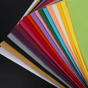 Colorful tissue paper detail showing multi-color wrapping paper sheets spread out neatly.