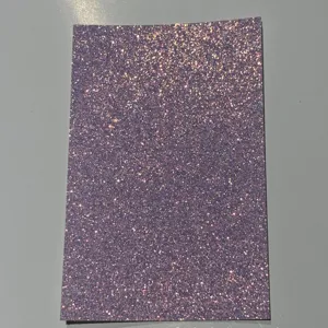 Purple glitter cardstock detail view, iridescent sparkly paper sheet for badge backing.