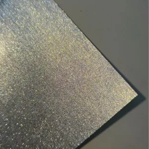 Close-up of glitter paper texture, showing sparkling fine sand special craft cardstock details.