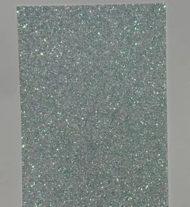 Fine glitter backing paper sheet for badge packaging and DIY craft decoration detail.