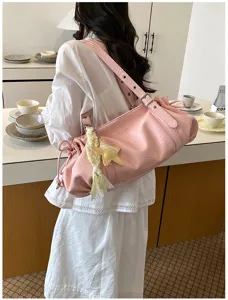 Pink pleated shoulder bag for women, stylish underarm commuter tote, spacious summer style.