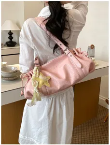 Pink pleated shoulder bag for women, stylish large capacity commuter tote with star charm.