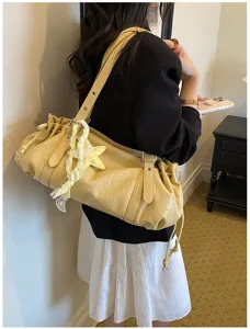 Yellow pleated hobo shoulder bag for women, stylish niche design casual commute tote bag.