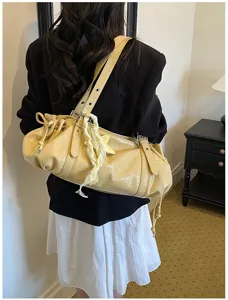 Vintage pleated shoulder bag for women, stylish yellow slouchy underarm tote with drawstring.