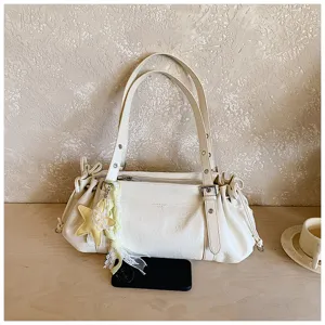 Ruched commuter tote bag for women, soft PU leather shoulder bag with chic star pendant.