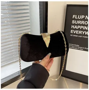 Black velvet evening clutch bag with gold leaf clasp and chain strap for party wedding.