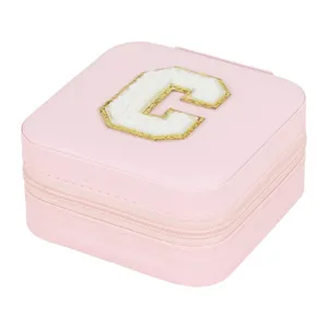 Pink PU leather travel jewelry box with cute letter C patch, compact ring and earring organizer.