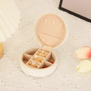 Detailed view of the round PU leather jewelry storage box, a portable ring and earring organizer.