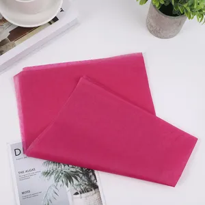 Hot pink wrapping tissue paper for gift boxes, shoes, and floral arrangements in detail view.