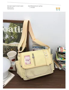 Detail view of a cute yellow canvas messenger ita bag with transparent badge window.