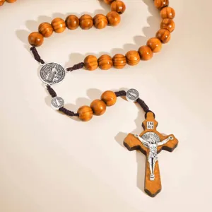 Vintage wooden bead rosary necklace featuring Saint Benedict medals and a crucifix pendant.