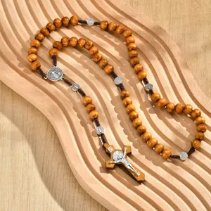 Vintage wooden rosary necklace featuring an alloy crucifix and Saint Benedict medals.