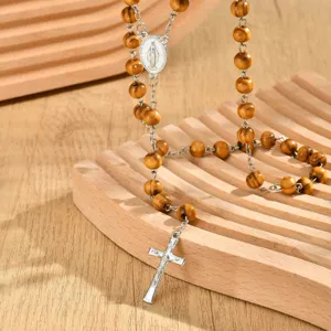 Retro pine wood bead Y-shaped necklace with alloy crucifix pendant and oval medal.