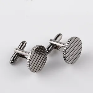 Men's round striped metal cufflinks for French dress shirts, classic detail accessory.