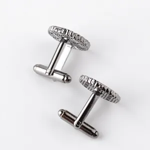 Close-up detail of stylish round gunmetal French cufflinks for men shirts, premium metallic shine.