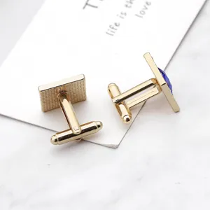 Boutons de manchette carrés dorés pour homme chemise avec incrustation de strass bleus.