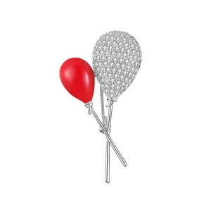 Exquisite double balloon brooch pin, crystal pavé and red enamel design for stylish outfits.