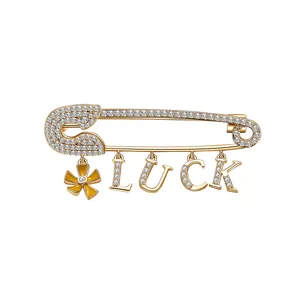 Broche épingle de sûreté dorée avec pavé de cristaux, fleur émail et pendentifs LUCK.