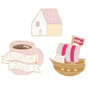 Detail view of Japanese style pink enamel brooch pins set featuring cute house and coffee cup.