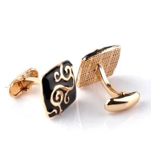 Elegant gold-plated square cufflinks with black enamel and intricate scroll patterns for business.