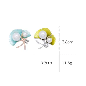 Elegant ginkgo leaf pearl brooch with sparkling crystals, fashion accessory for women.