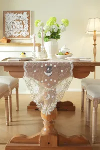 White gold star moon lace table runner decorative detail view for dining room decor.