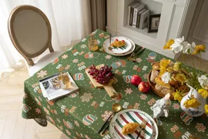 Detail view of the retro Christmas jacquard tablecloth styled with holiday tableware and festive decor.