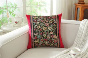 Close-up detail of the vintage jacquard floral pillow cover on a cozy sofa, perfect decor.
