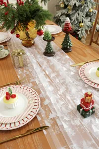 White sheer mesh Christmas table runner with silver stamped trees and snowflakes, festive decor.