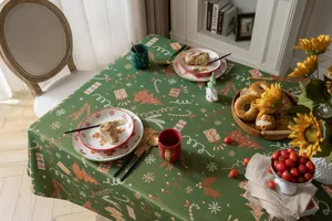 Detailed view of a retro Christmas jacquard tablecloth featuring festive trees and gift patterns.