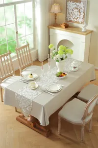 Elegant white and gold lace table runner with star moon embroidery for dining table decor.