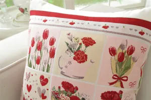 Close-up detail of vintage jacquard floral pattern cushion cover featuring charming pink and red tones.