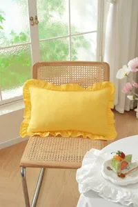 French pastoral style yellow throw pillow detail, exquisite ruffled edge design for cozy decor.
