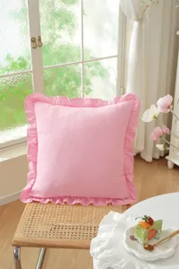 Pink cotton ruffle throw pillow cover detail view, soft lifestyle cushion for home decor.