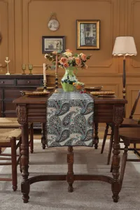 Close-up of the vintage paisley woven table runner, displaying exquisite jacquard texture.