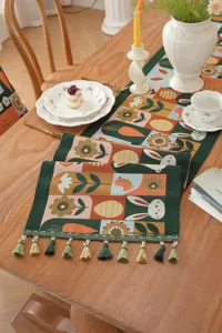 Easter table runner detail view showing intricate jacquard weave with rabbits, carrots and eggs.