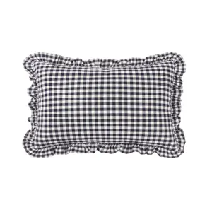 Close-up detail of the black and white checkered throw pillow with ruffled frill edges.