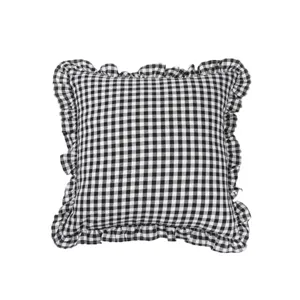 Black and white checkered throw pillow with ruffled edges for cozy home decor and sofa styling.
