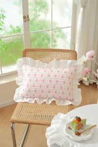 French style cotton ruffled bow pillow detail, soft textured decorative cushion cover.