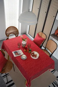 Red jacquard tablecloth with gold lace trim, elegant dining table cover for festive home decor.