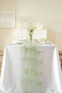 Vintage embroidered table runner with colorful floral lace, perfect for wedding and dining decor.