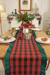Christmas red and green plaid table runner with ruffles, festive holiday home decor.