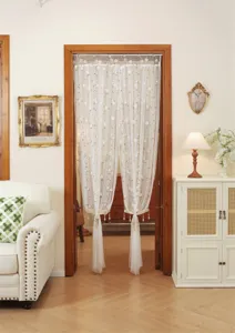 Exquisite lace door curtain with floral embroidery and hanging beads for elegant home decor.